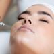 Woman receiving a professional Oxygen Facial Reston VA treatment at a luxury skincare spa