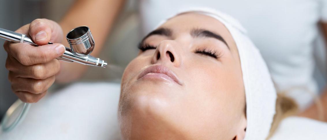 Woman receiving a professional Oxygen Facial Reston VA treatment at a luxury skincare spa